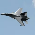 Over Syria, A Russian Fighter Jet Flies Near An American Warplane