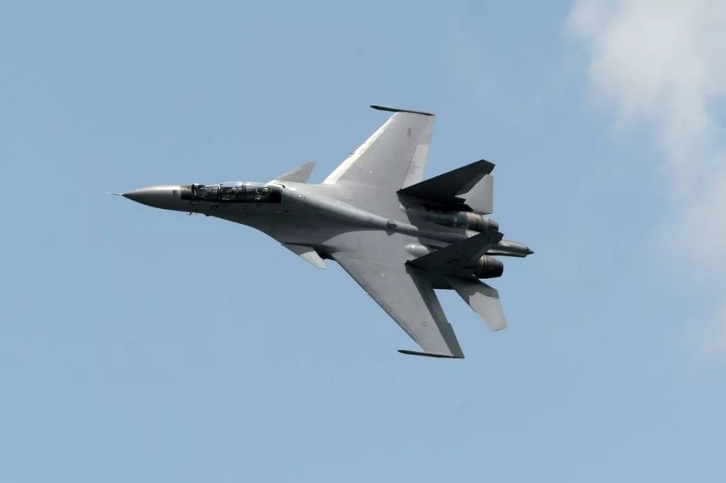 Over Syria, A Russian Fighter Jet Flies Near An American Warplane